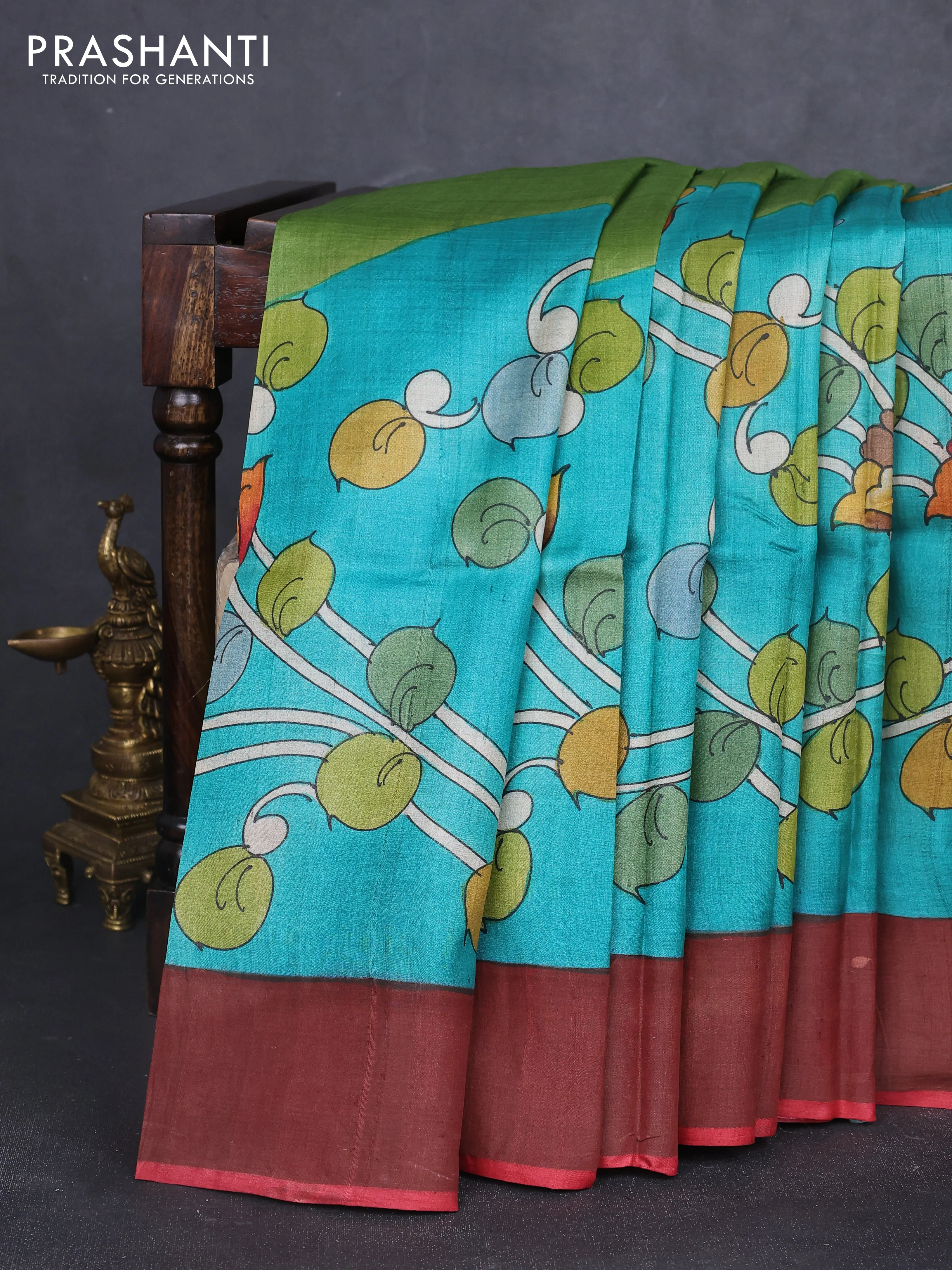 Pure tussar silk saree teal green and peach pink with allover kalamkari hand painted prints and zari woven border