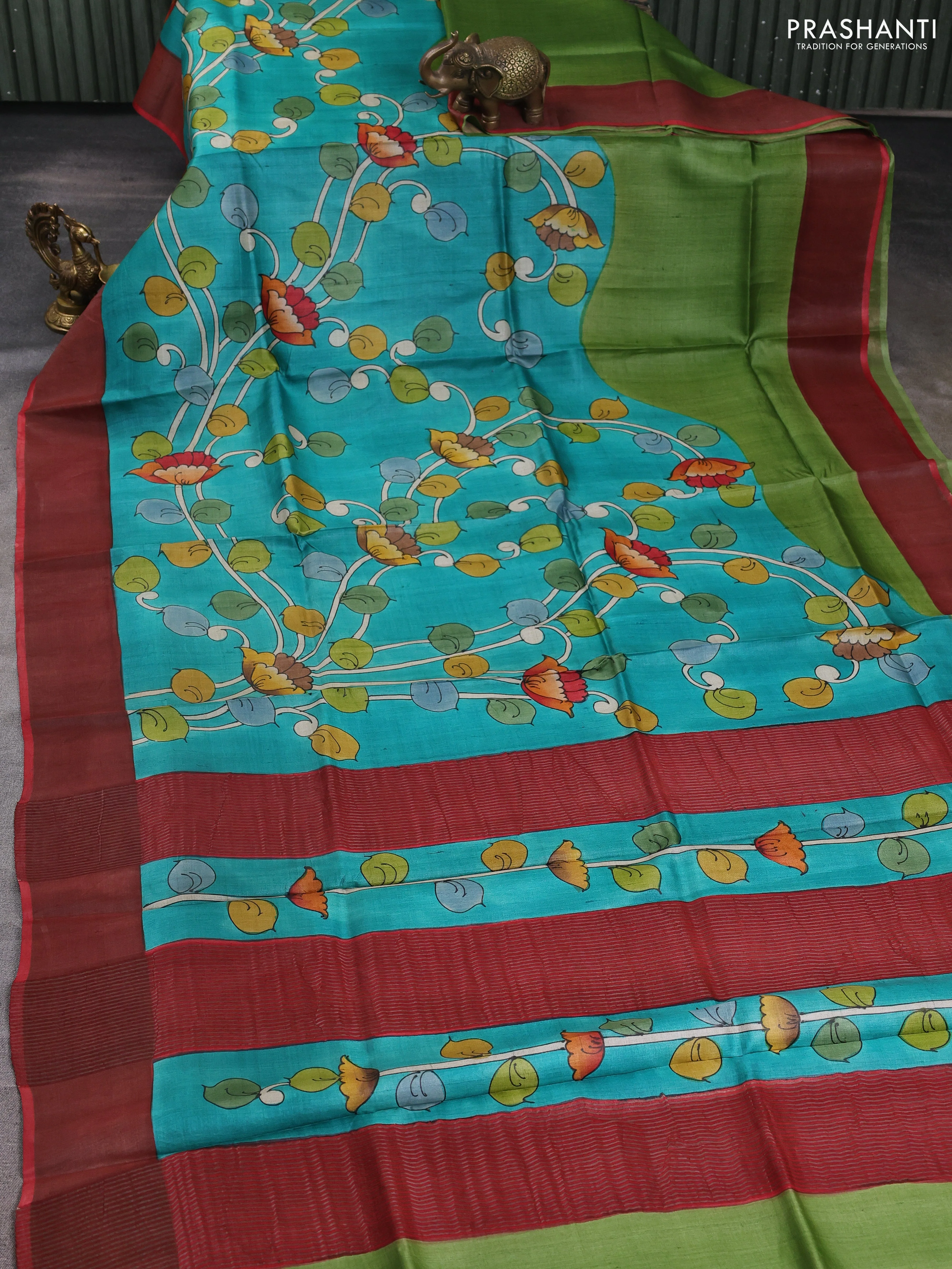 Pure tussar silk saree teal green and peach pink with allover kalamkari hand painted prints and zari woven border - Image 2
