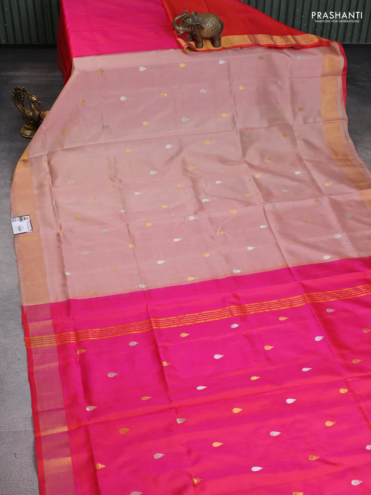 Pure uppada partly silk saree peach shade and dual shade of pinkish orange with silver & gold zari woven tilak buttas and zari woven border - Image 2