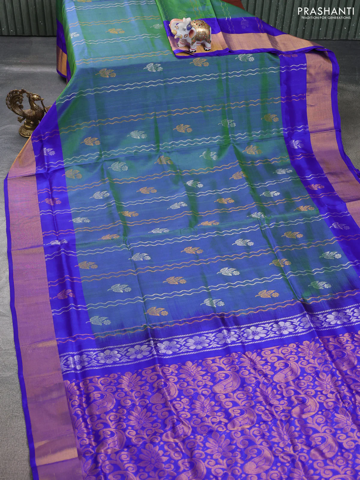 Pure uppada silk saree dual shade of greenish blue and blue with allover zari weaves silver & gold buttas and zari woven border - Image 2