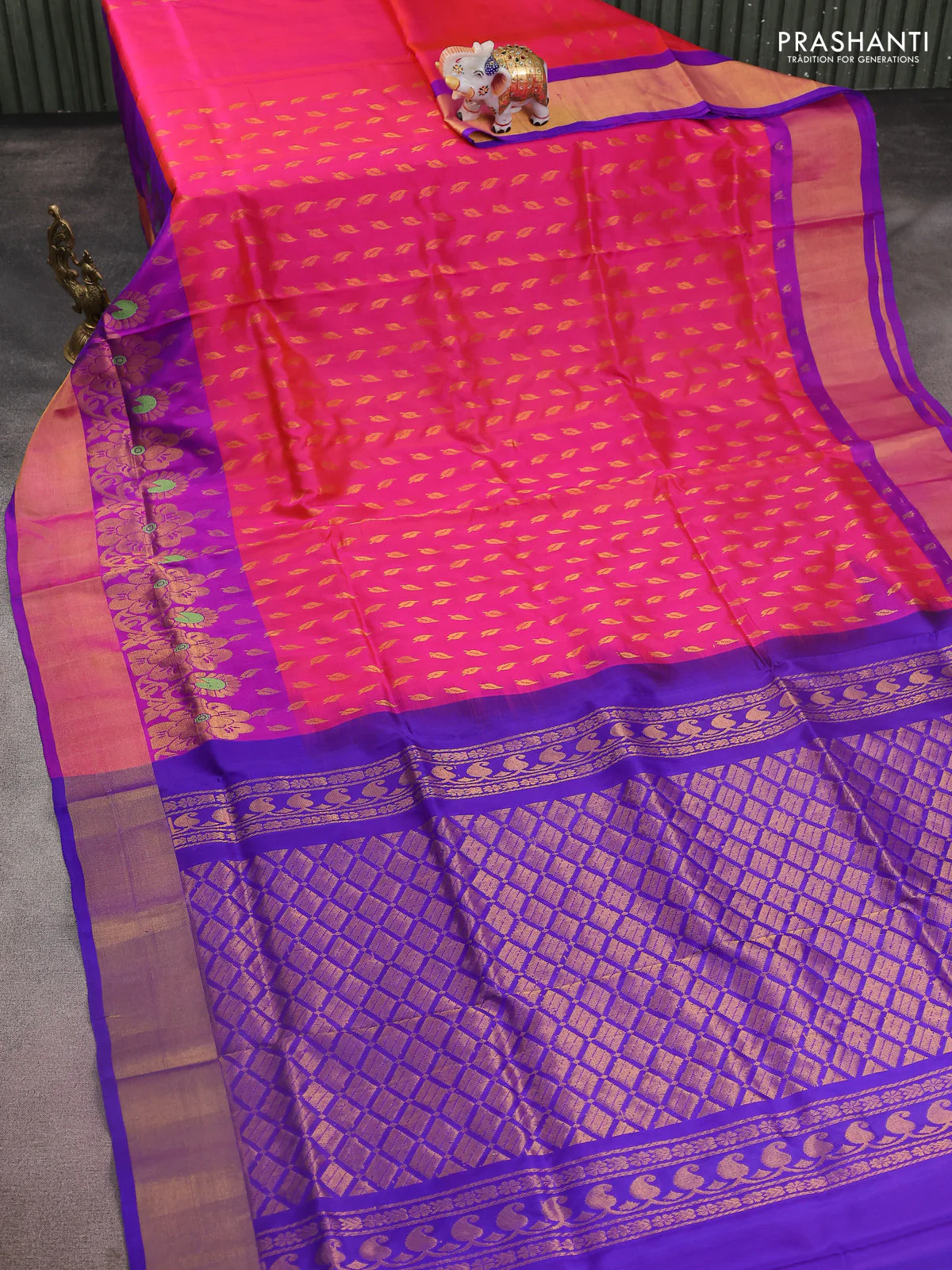 Pure uppada silk saree dual shade of pinkish orange and blue with allover zari woven leaf buttas and floral design zari woven border - Image 2