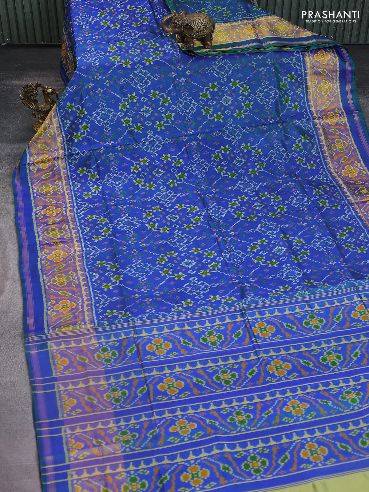 Rajkot patola silk saree dual shade of greenish blue with allover ikat weaves and ikat woven zari border - Image 2