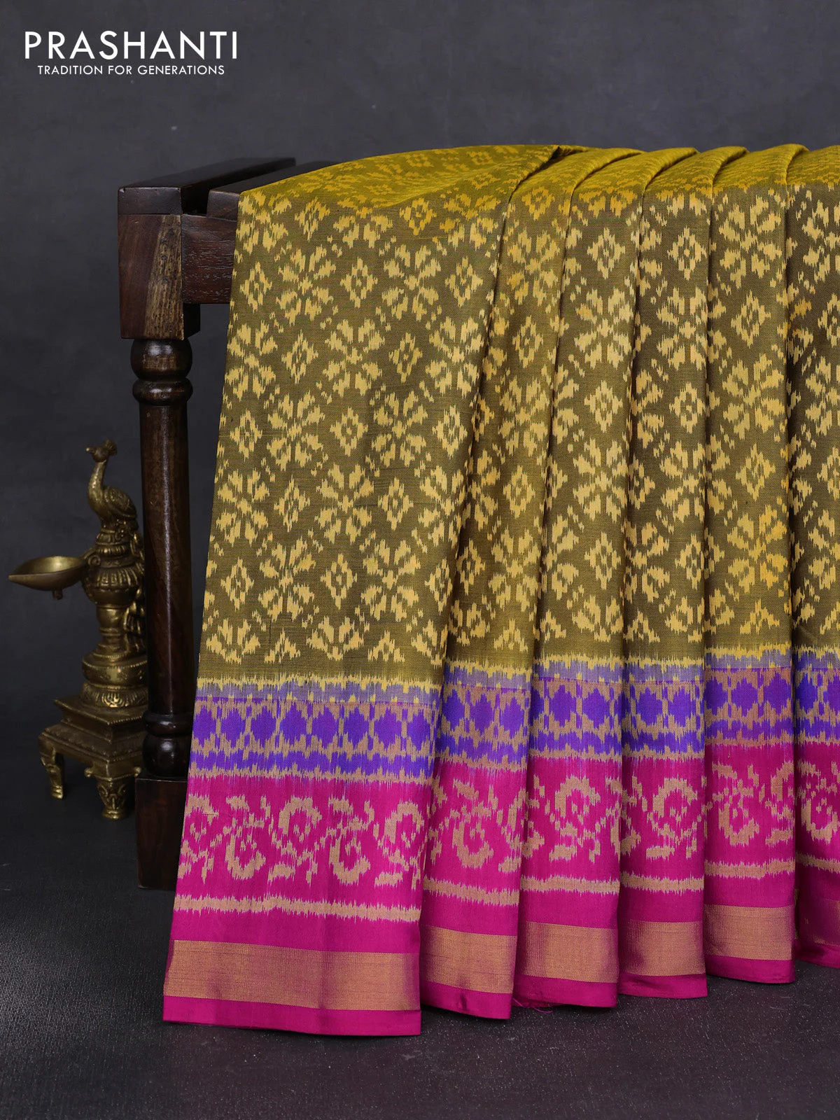 Rajkot patola silk saree mehendi green and pink with allover ikat weaves and ikat woven zari border