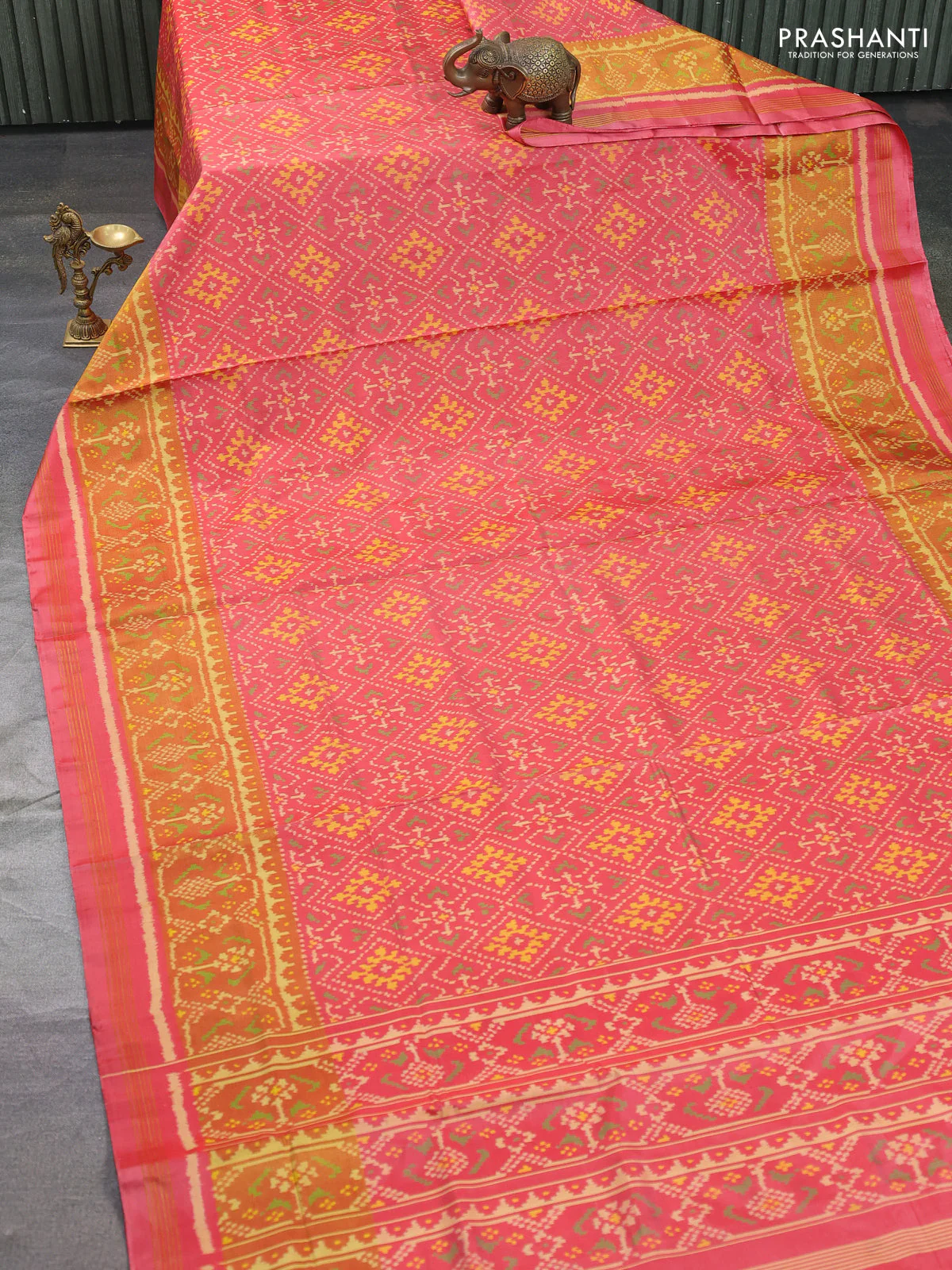 Rajkot patola silk saree peach pink shade with allover ikat weaves and ikat woven border - Image 2