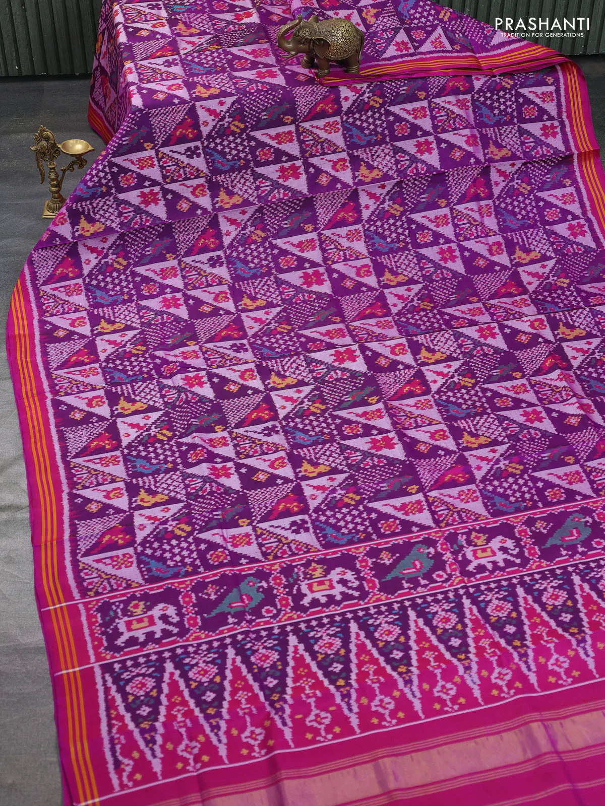 Rajkot patola silk saree purple and darl magenta pink with allover ikat weaves and ikat woven border - Image 2