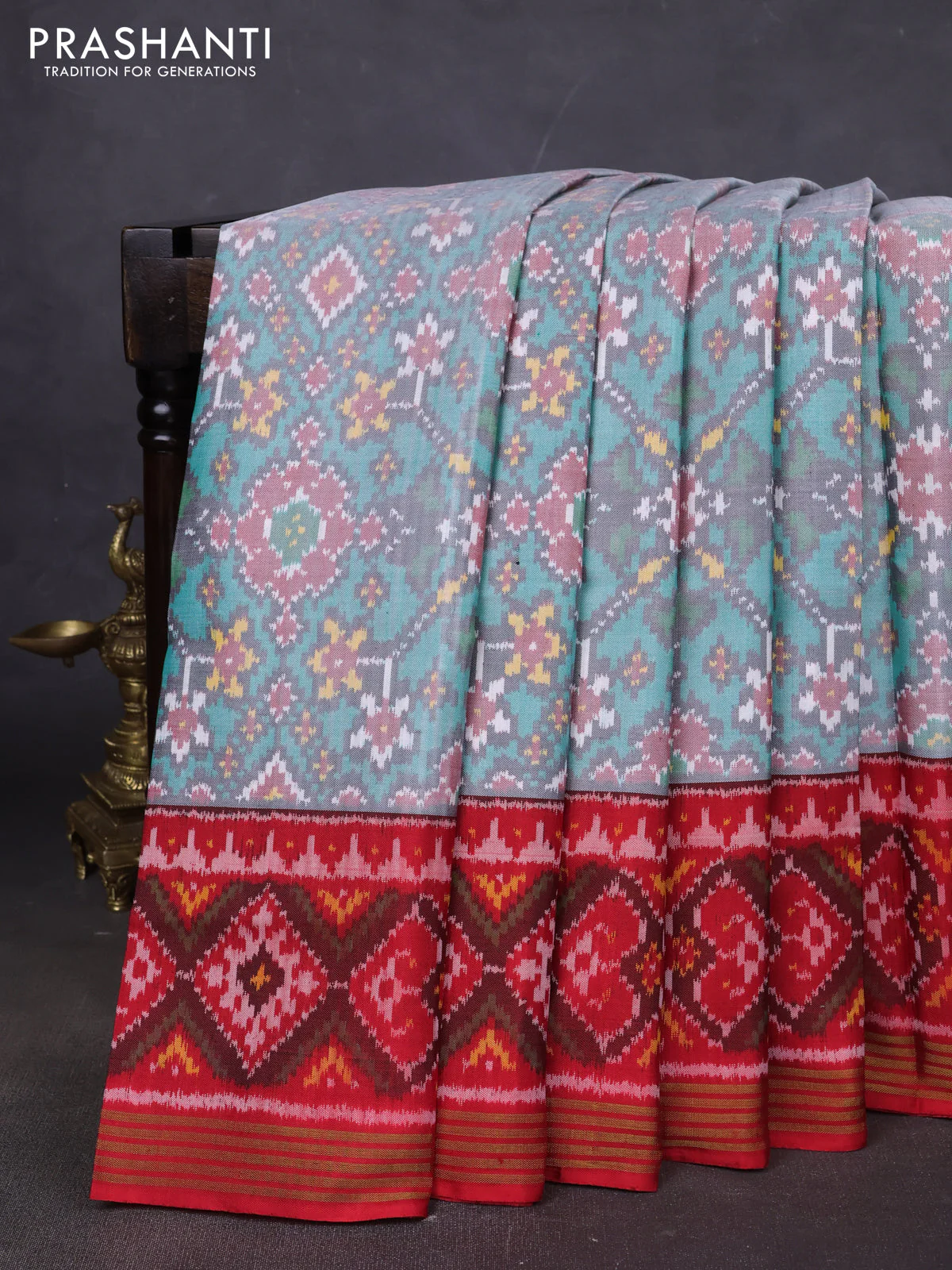 Rajkot patola silk saree tea l blue and red with allover ikat weaves and ikat woven zari border