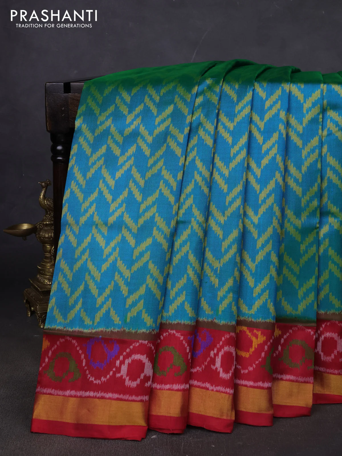 Rajkot patola silk saree teal blue and maroon with allover ikat weaves and ikat woven border