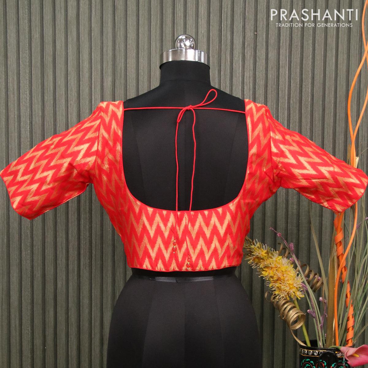 Readymade brocade blouse orange with allover ikat zari weaves and back knot - Image 2