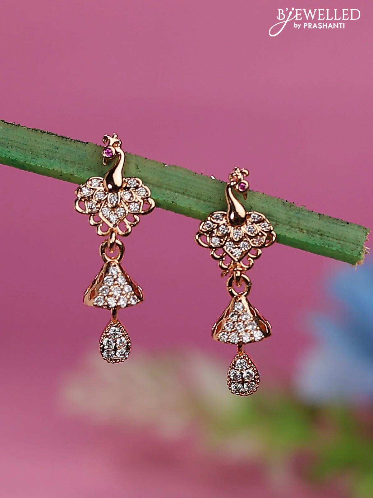 Rose gold earrings with peacock design and cz stones
