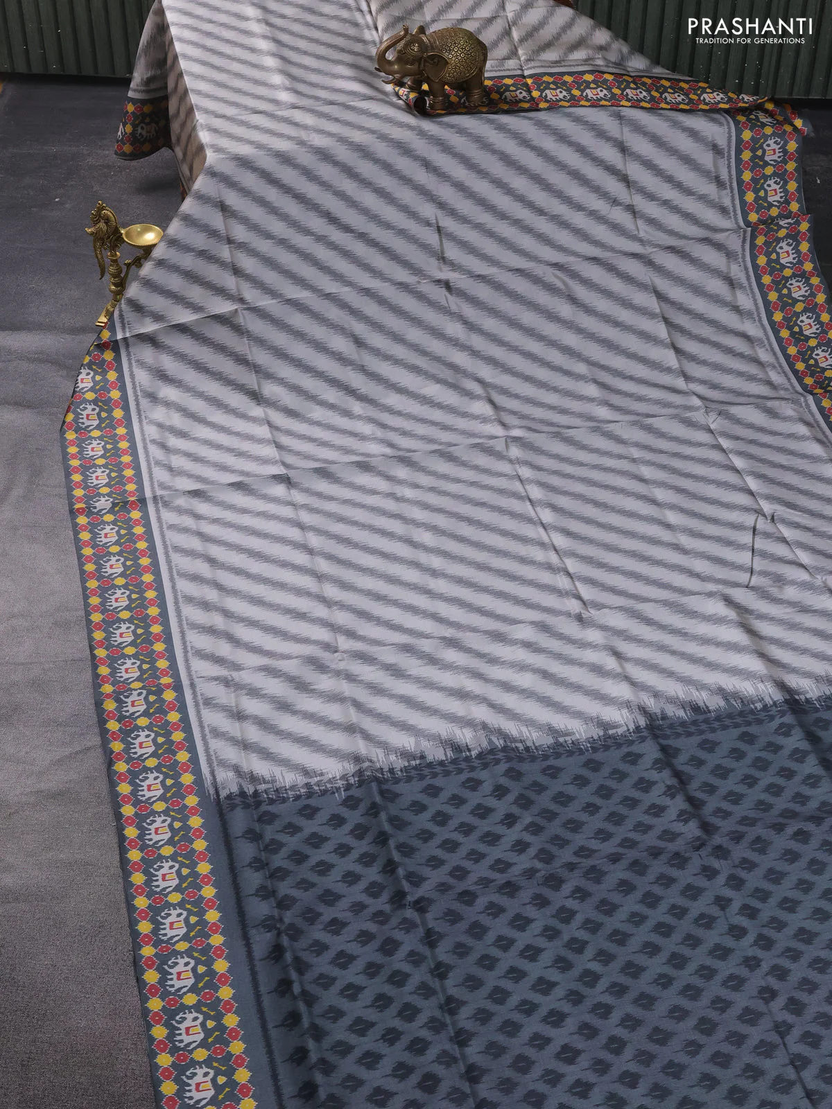 Sambalpuri semi silk saree pastel grey and grey with allover leheriya ikat weaves and patola printed border - Image 2