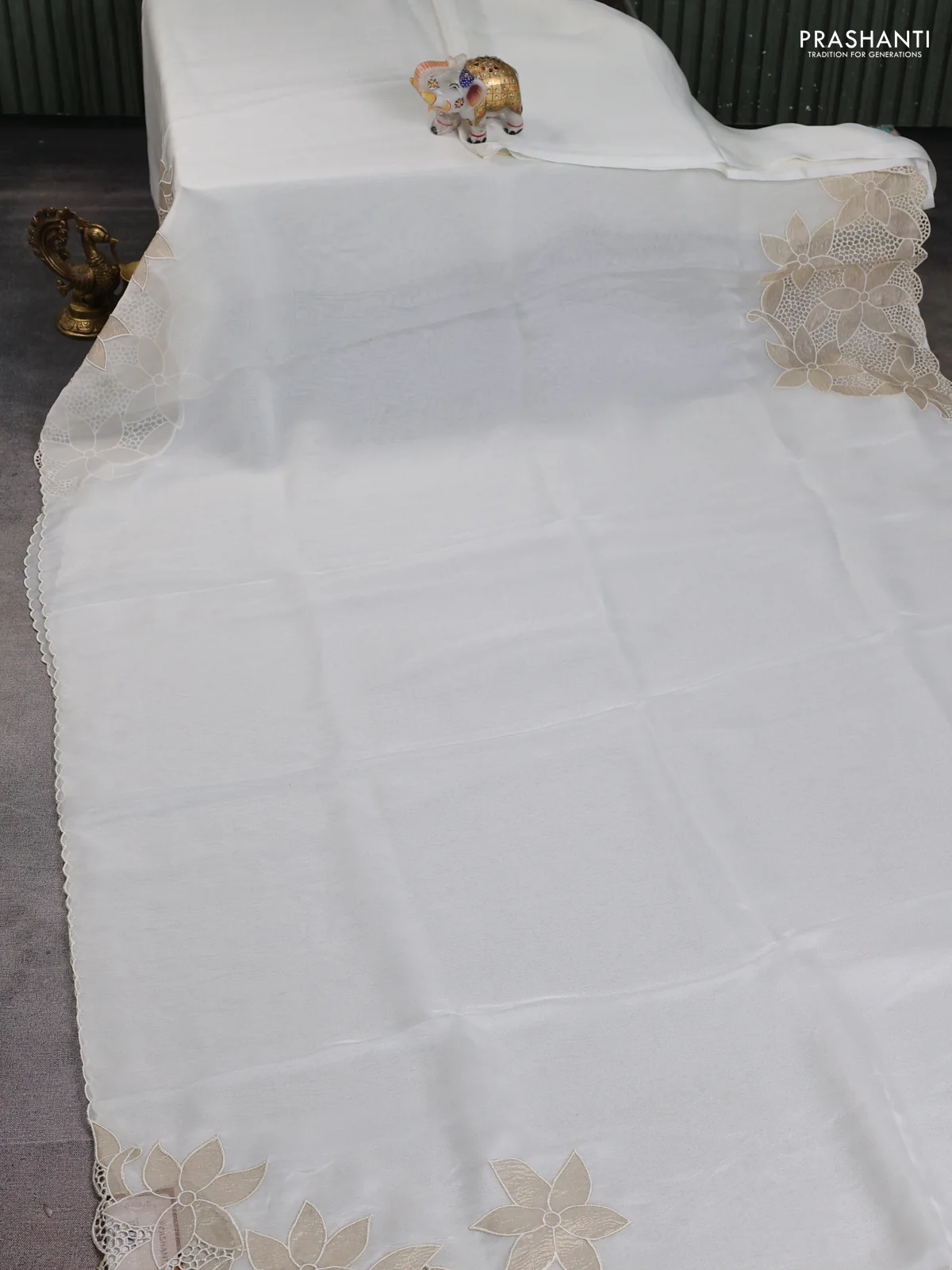 Satin Organza saree off white with plain body and floral design cut work border - Image 4
