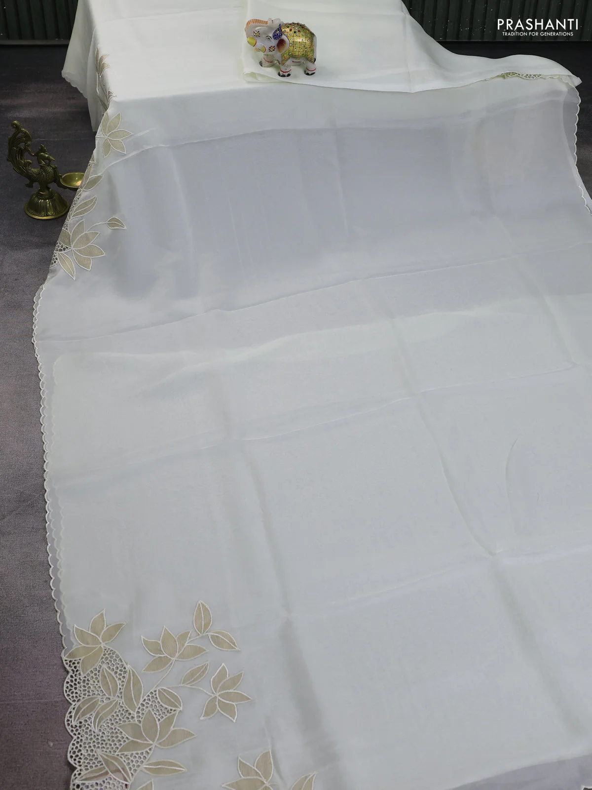 Satin Organza saree off white with plain body and floral design cut work border - Image 4