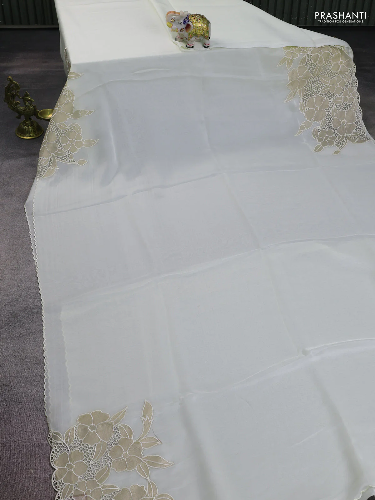 Satin Organza saree off white with plain body and floral design cut work border - Image 4