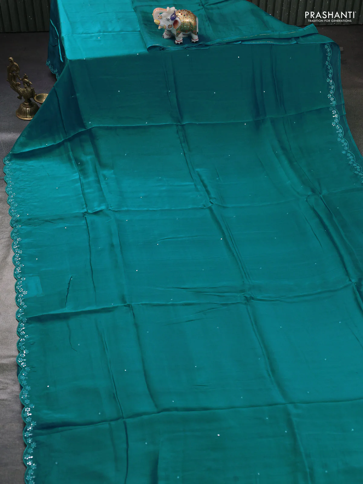 Satin organza silk saree teal blue and cream with mirror embroidery work and ajrakh printed blouse - Image 2