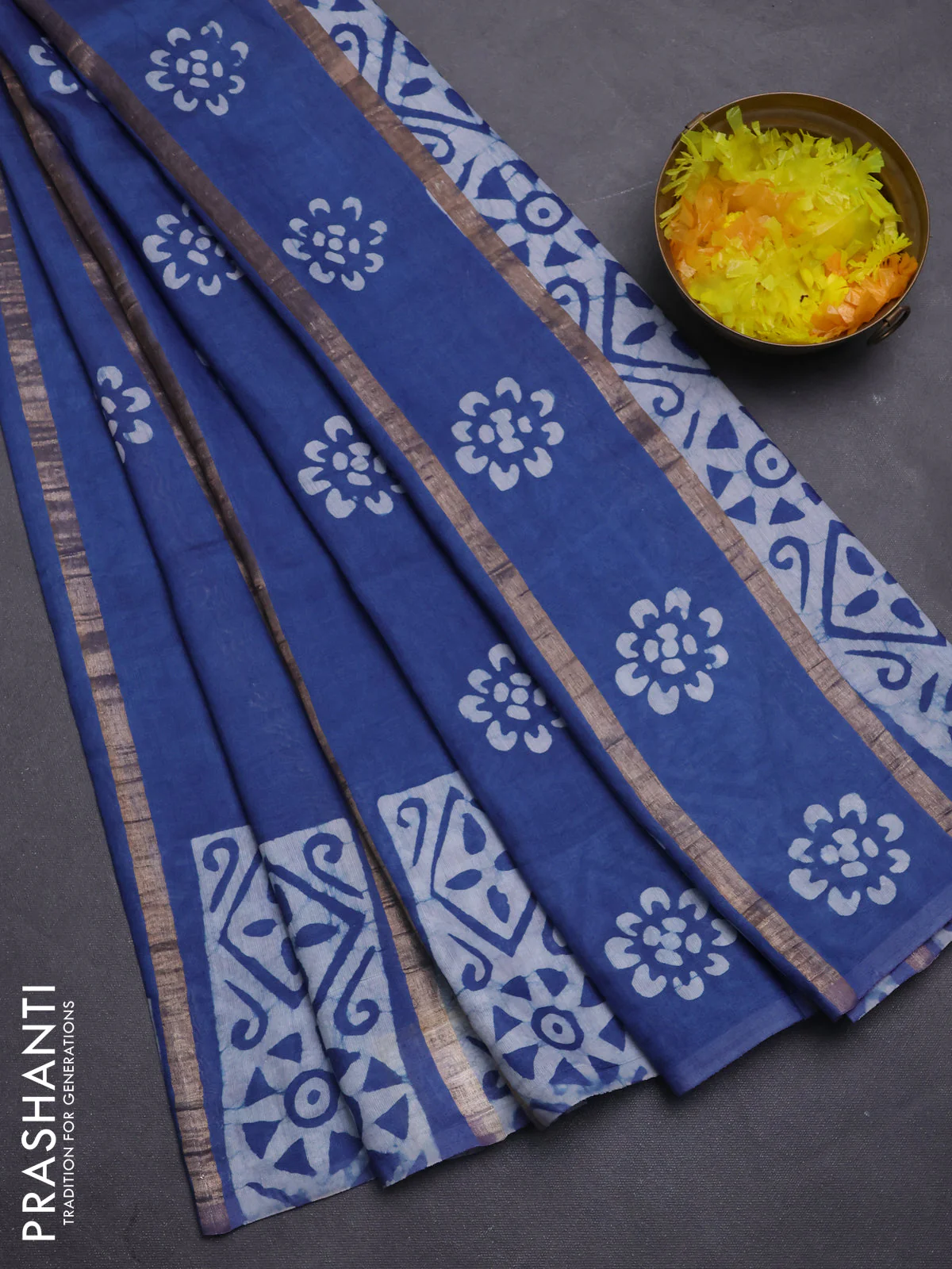 Semi chanderi saree blue with allover zari strips & batik butta prints in borderless style