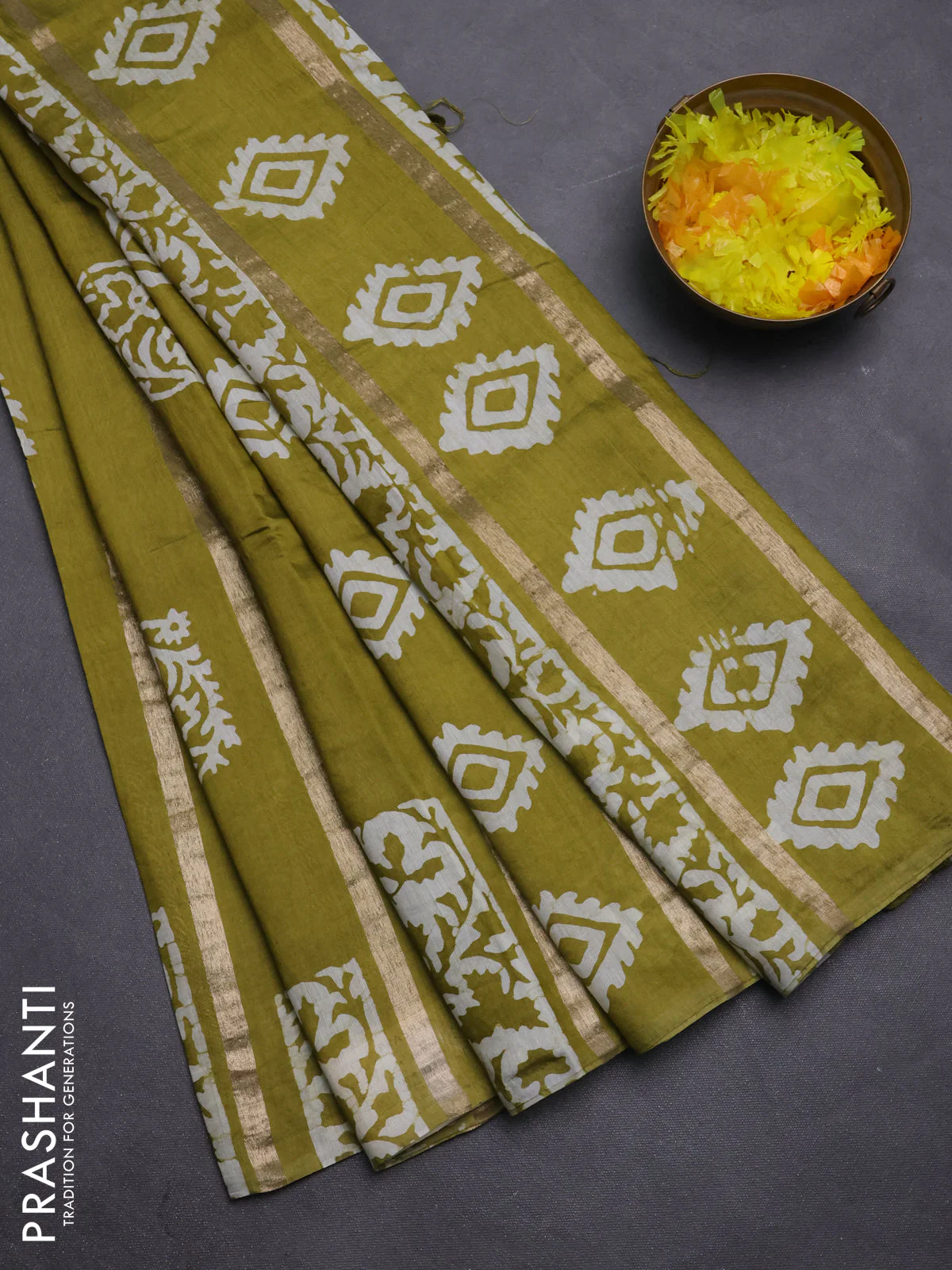 Semi chanderi saree mehendi green with allover zari strips & batik butta prints in borderless style