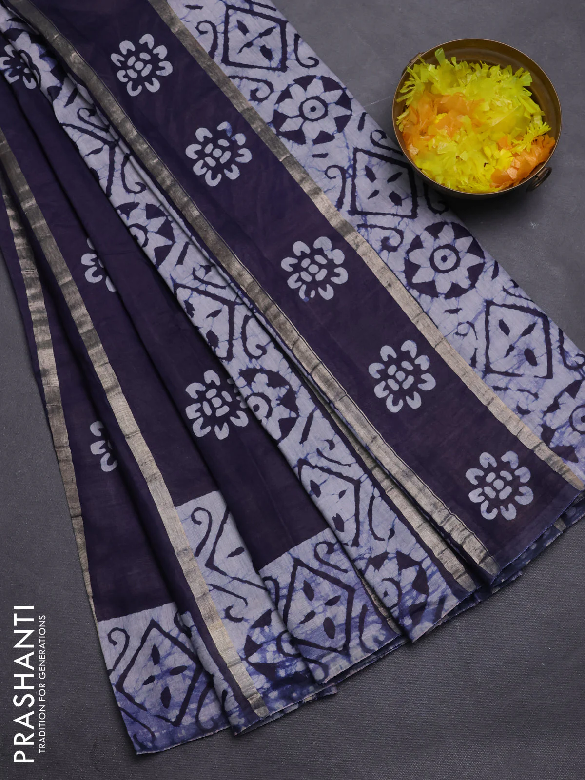 Semi chanderi saree navy blue with allover zari strips & batik butta prints in borderless style