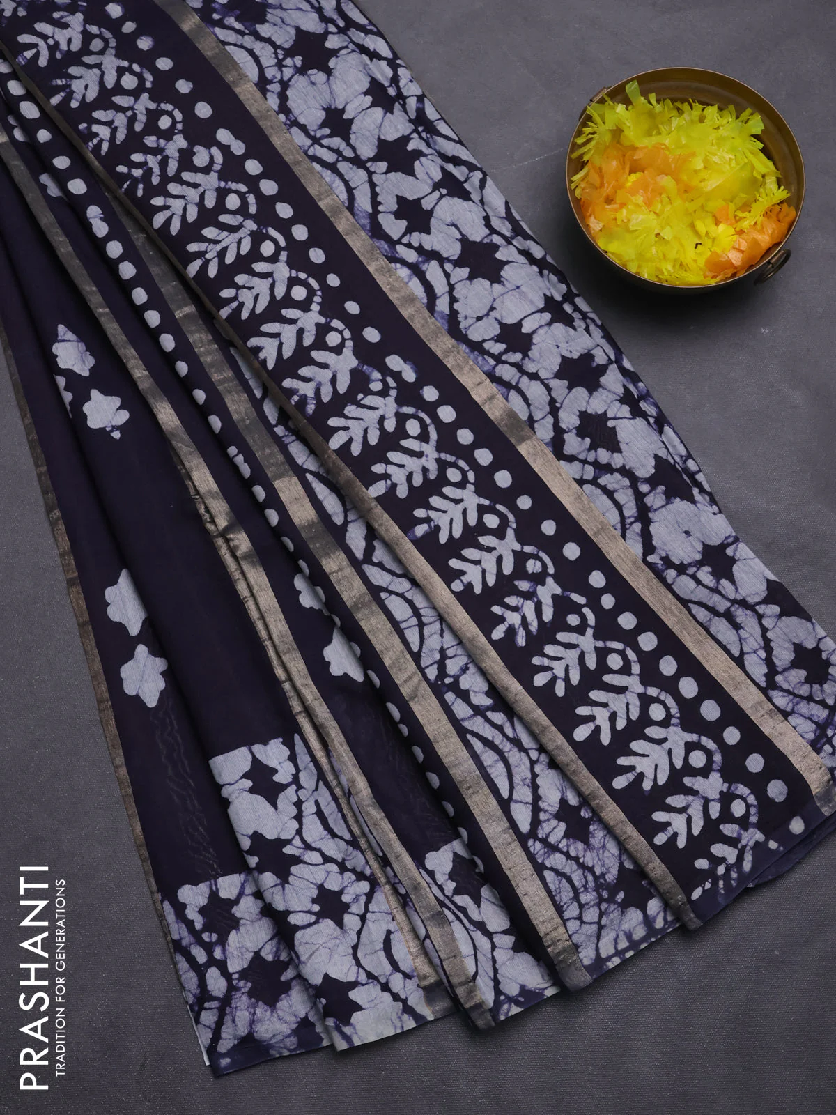 Semi chanderi saree navy blue with allover zari strips & batik butta prints in borderless style