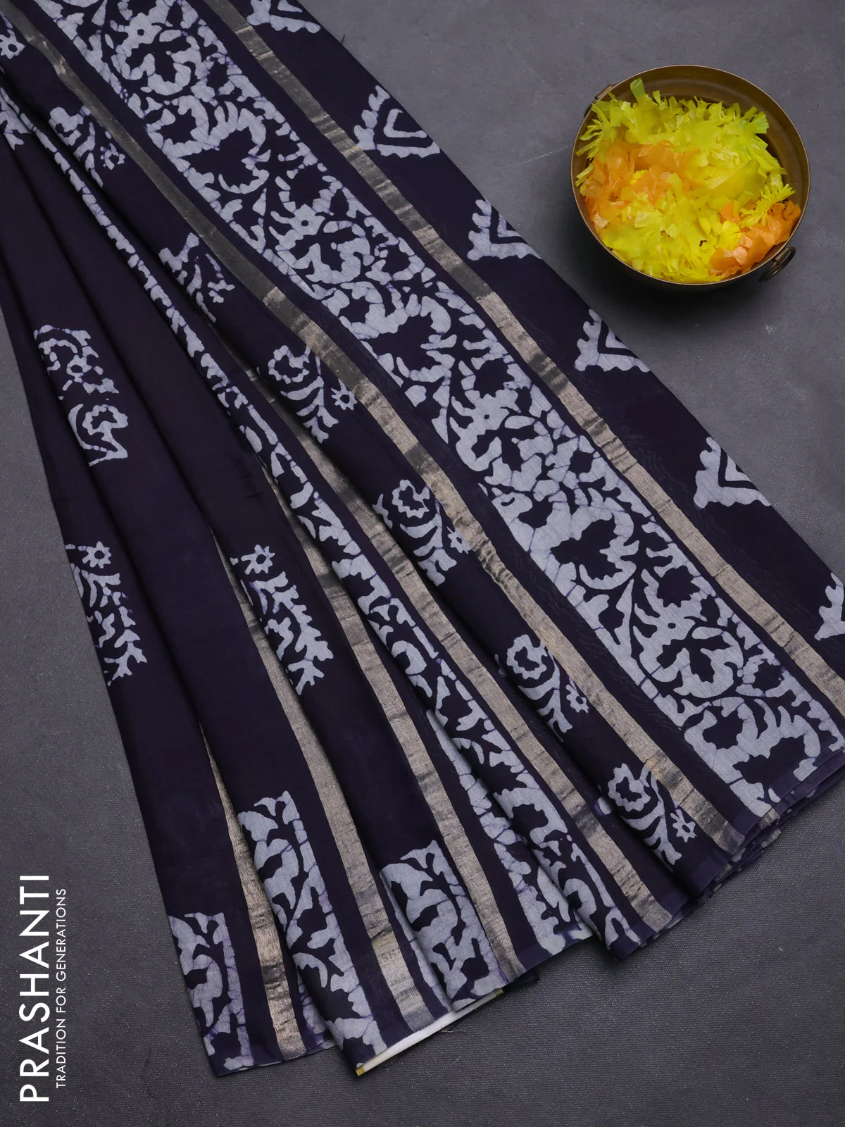 Semi chanderi saree navy blue with allover zari strips & batik butta prints in borderless style