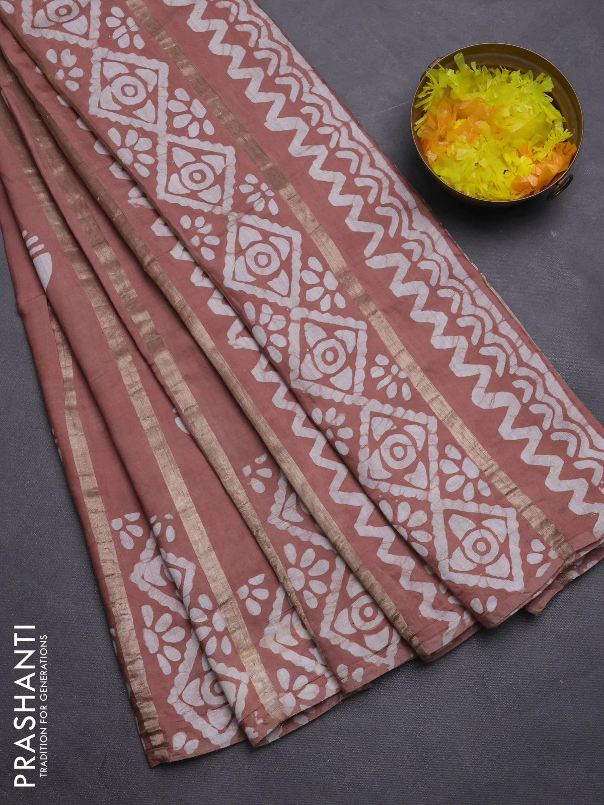 Semi chanderi saree pastel brown with allover zari strips & batik butta prints in borderless style