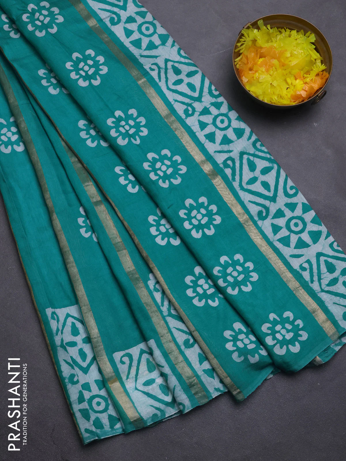 Semi chanderi saree teal green with allover zari strips & batik butta prints in borderless style