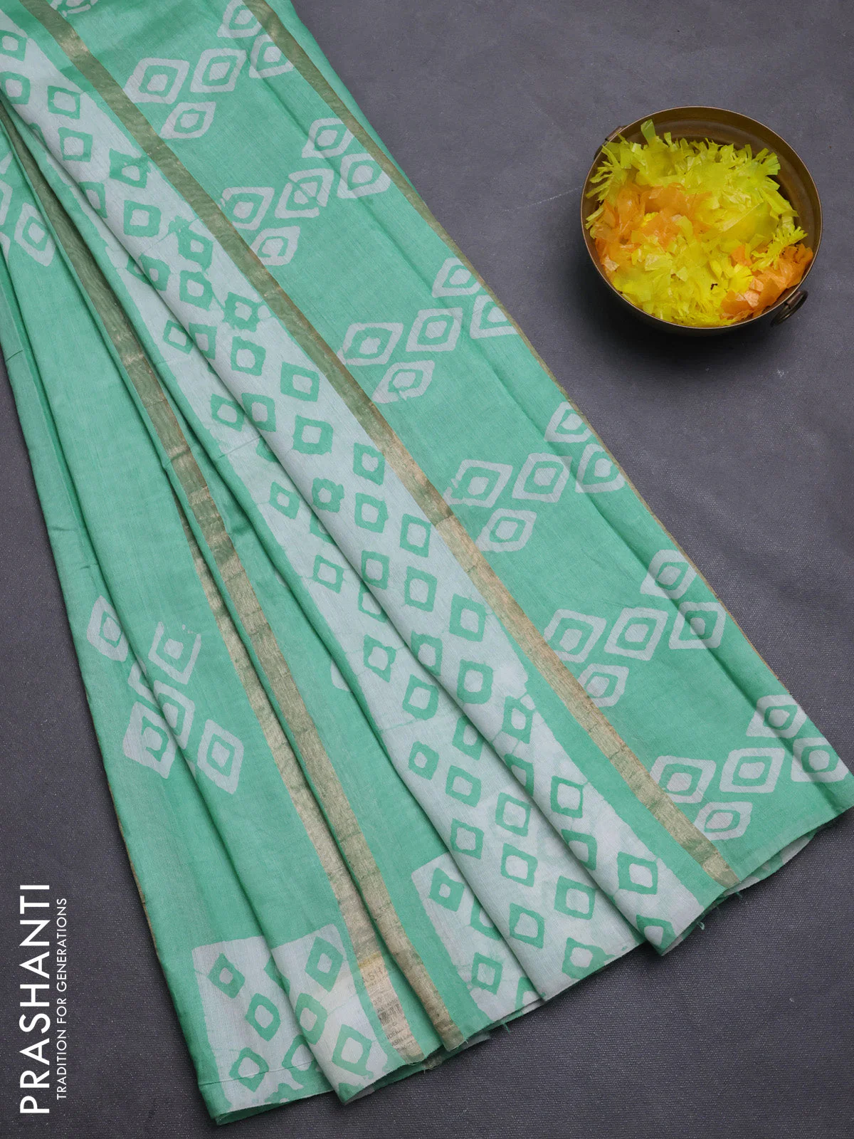 Semi chanderi saree teal green with allover zari strips & batik butta prints in borderless style