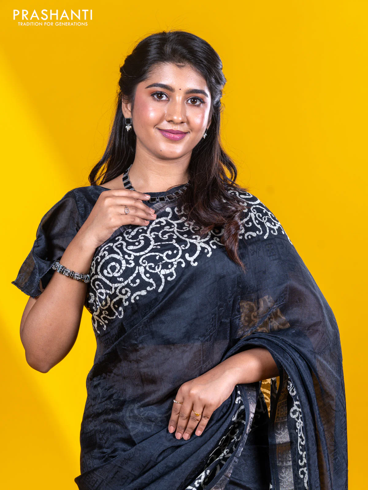 Semi crepe saree black with allover self emboss and batik printed border - Image 3