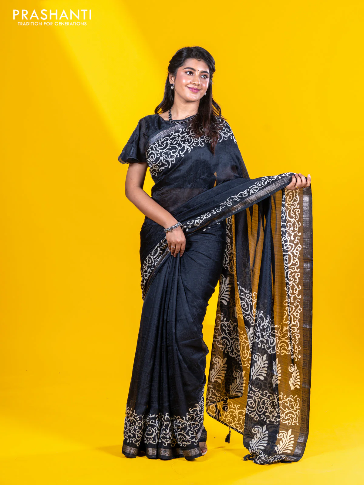Semi crepe saree black with allover self emboss and batik printed border - Image 5
