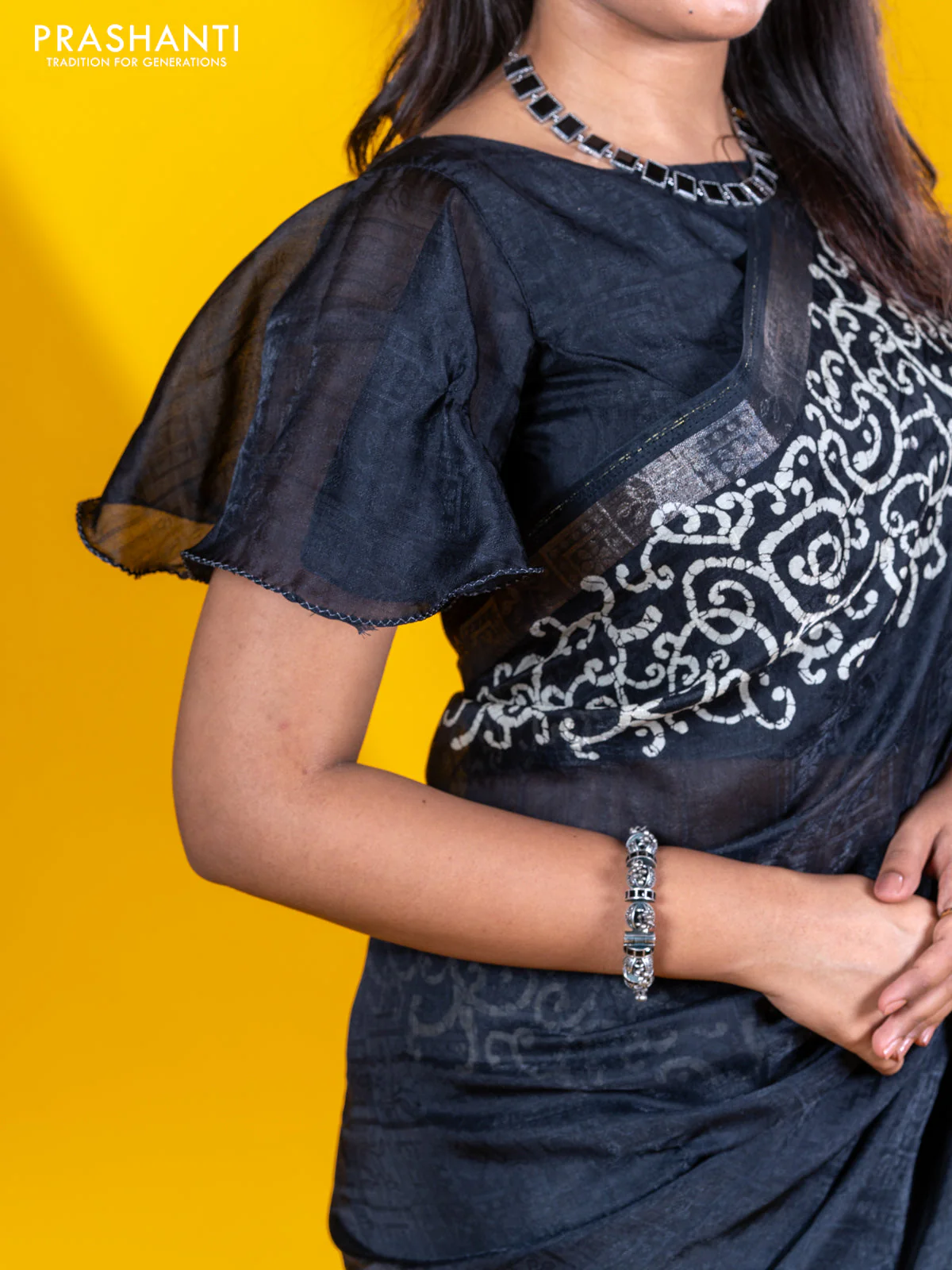 Semi crepe saree black with allover self emboss and batik printed border - Image 7