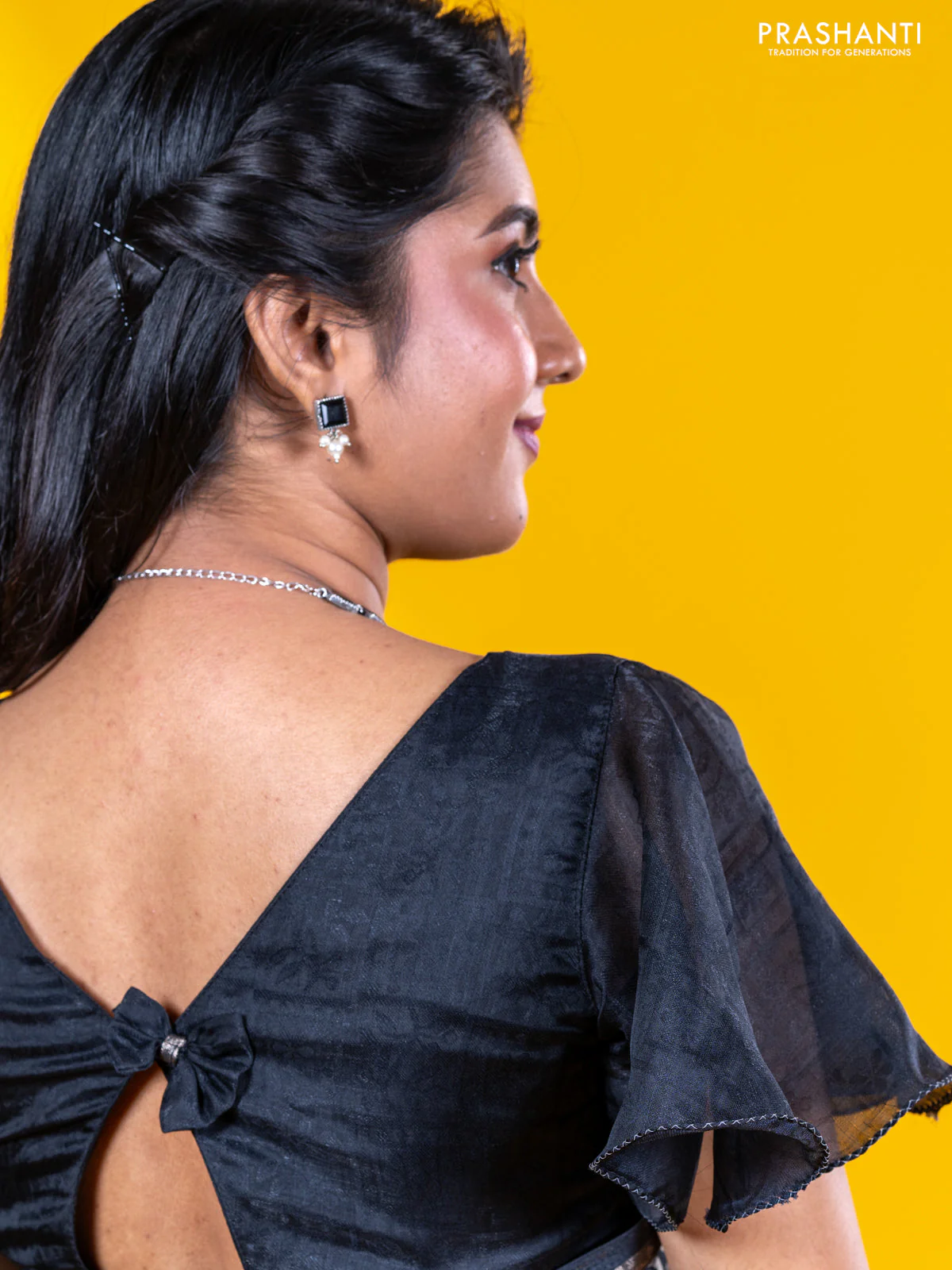 Semi crepe saree black with allover self emboss and batik printed border - Image 9