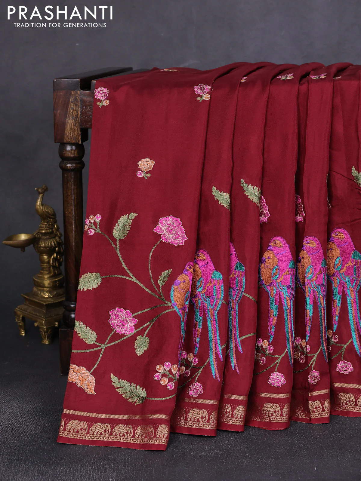Semi crepe silk saree deep maroon with allover embroidery and elephant zari woven border