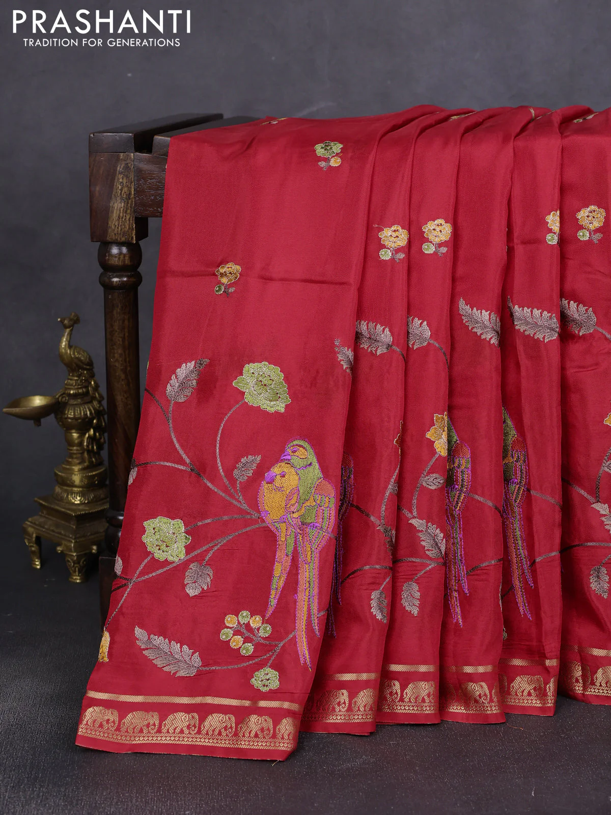Semi crepe silk saree red with allover embroidery and elephant zari woven border