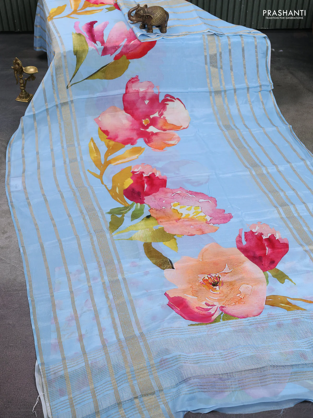 Semi georgette saree blue shade with allover floral prints and long zari woven border - Image 2
