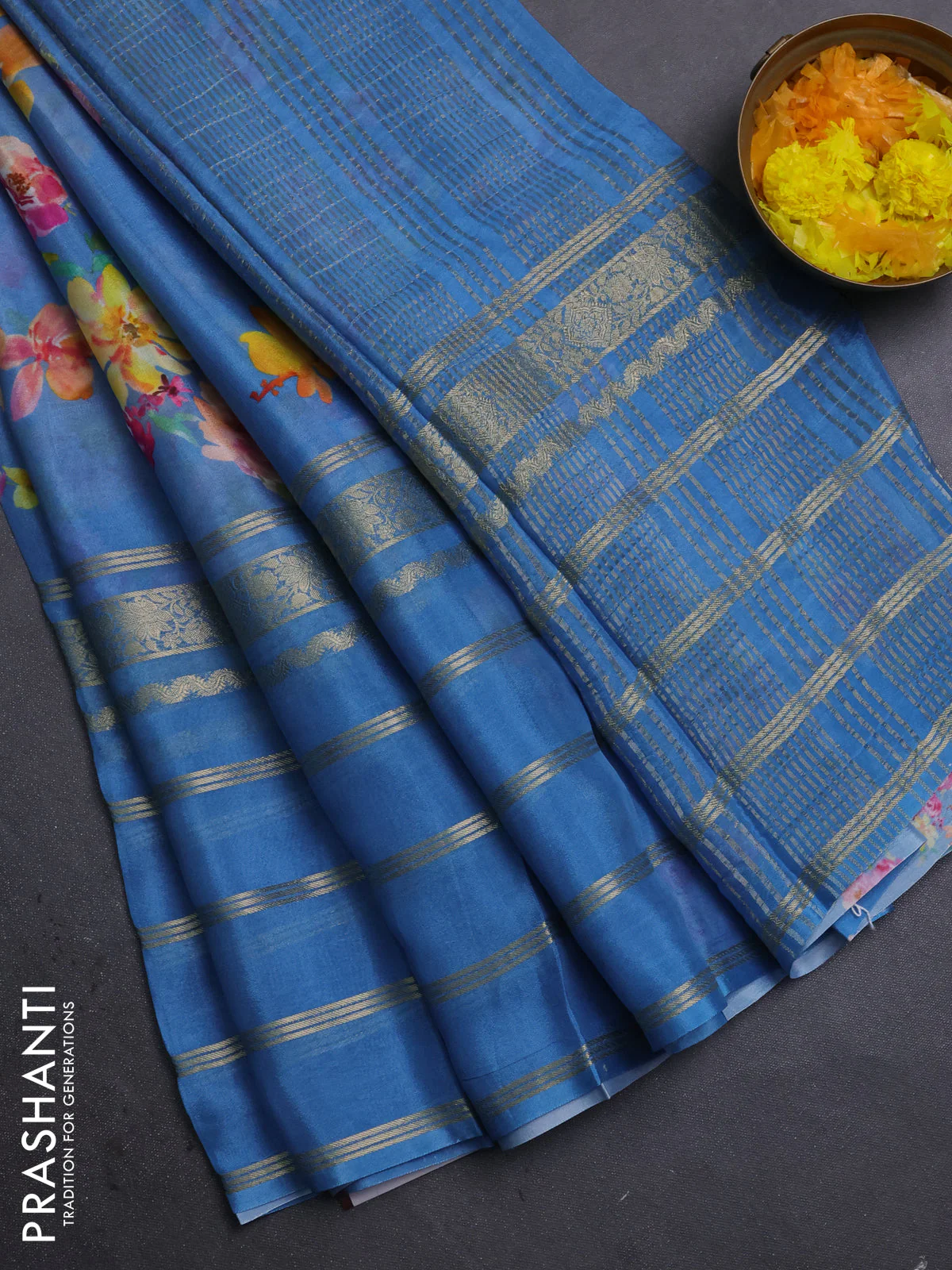 Semi georgette saree blue with allover floral prints and long zari woven border
