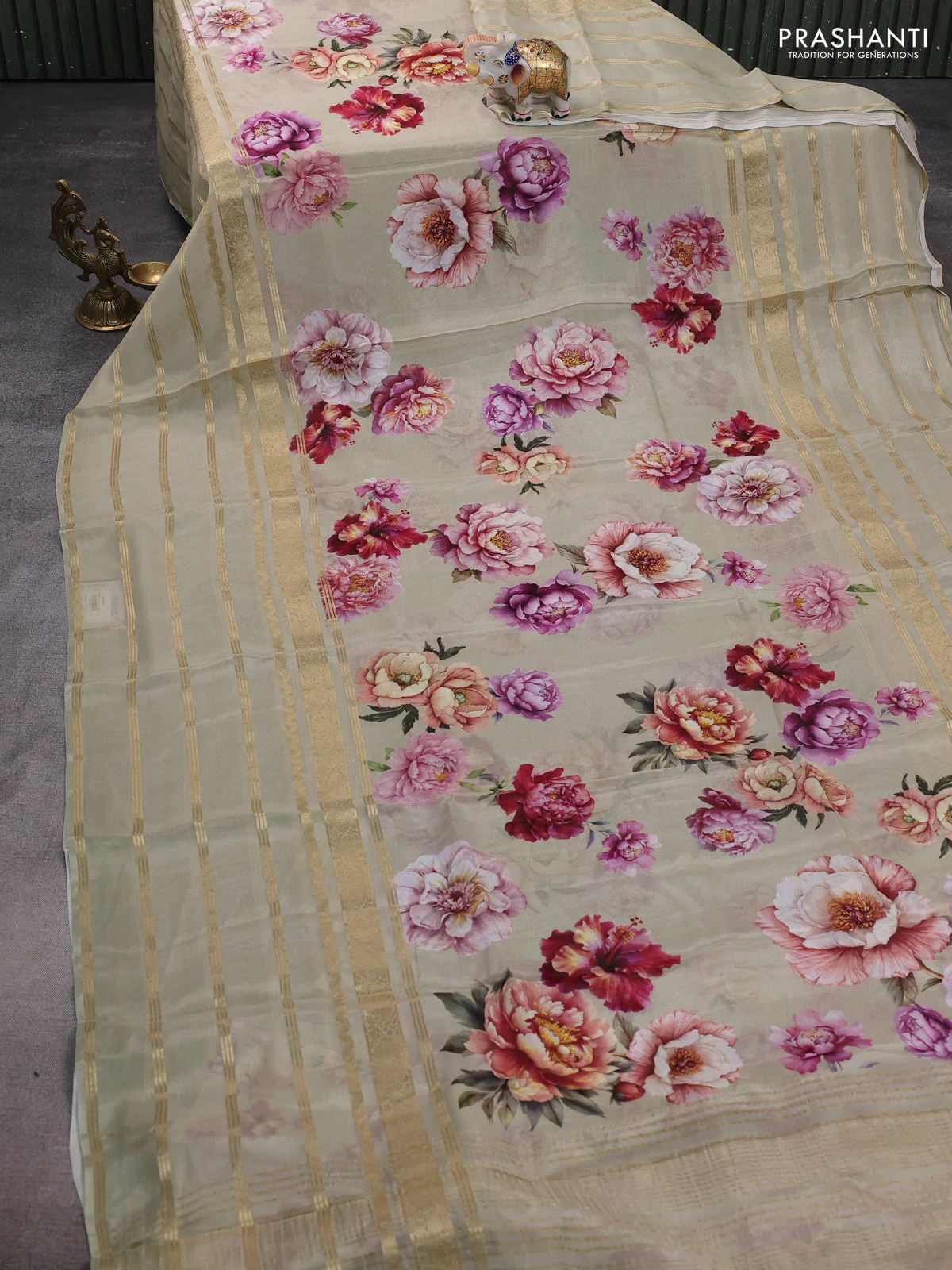 Semi georgette saree elaichi green with allover floral prints and long zari woven border - Image 2