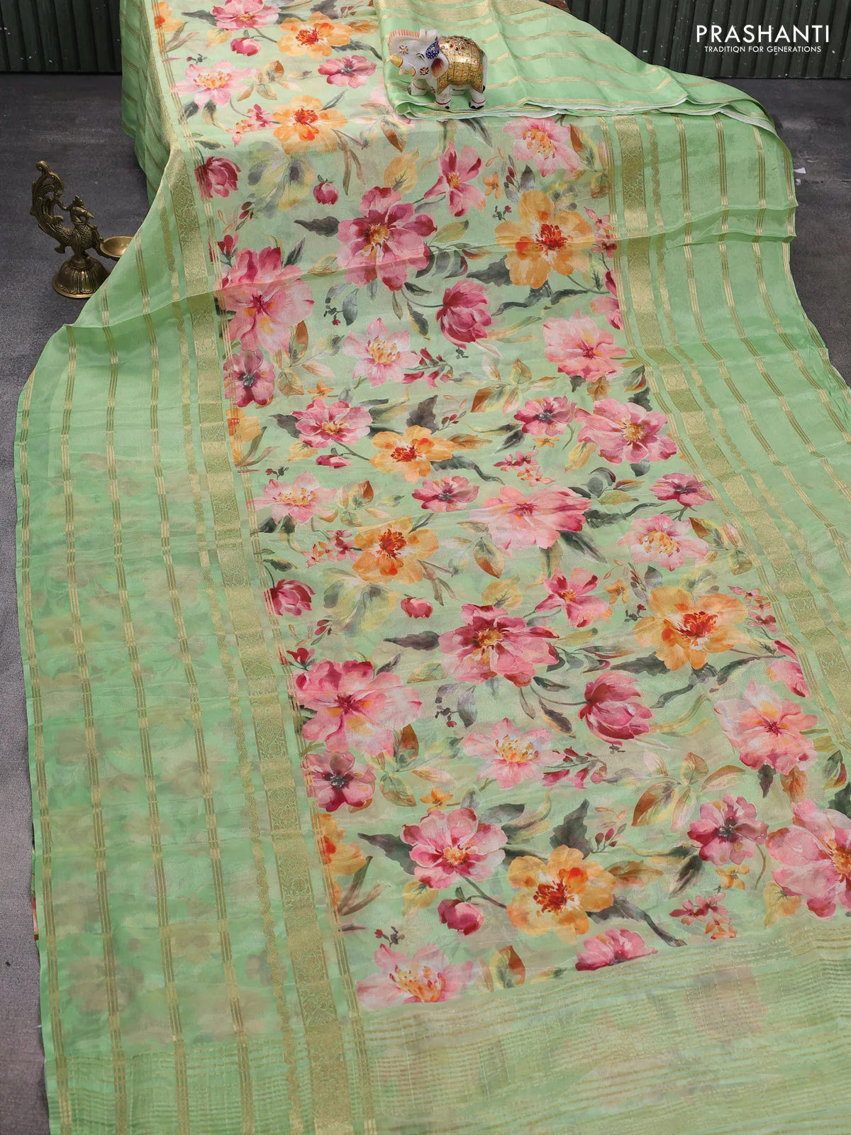 Semi georgette saree light green with allover floral prints and long zari woven border - Image 2