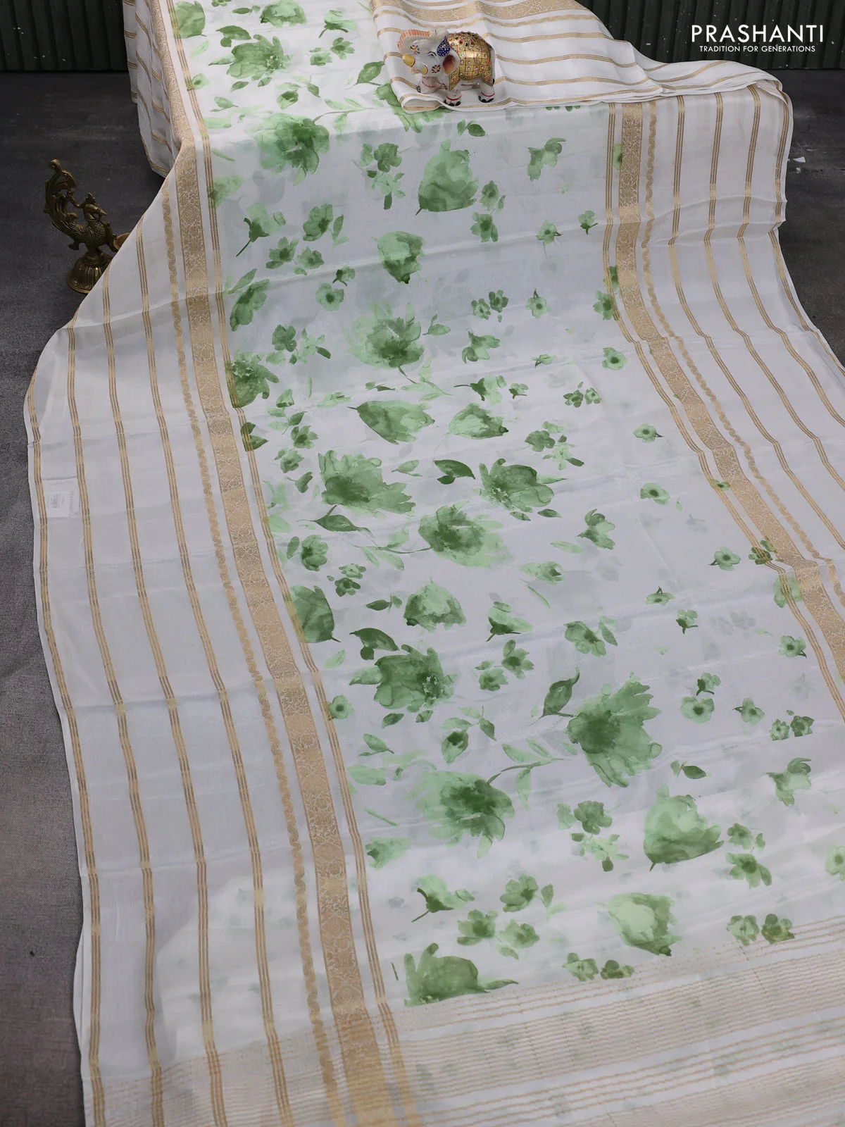 Semi georgette saree off white and green with allover floral prints and long zari woven border - Image 2