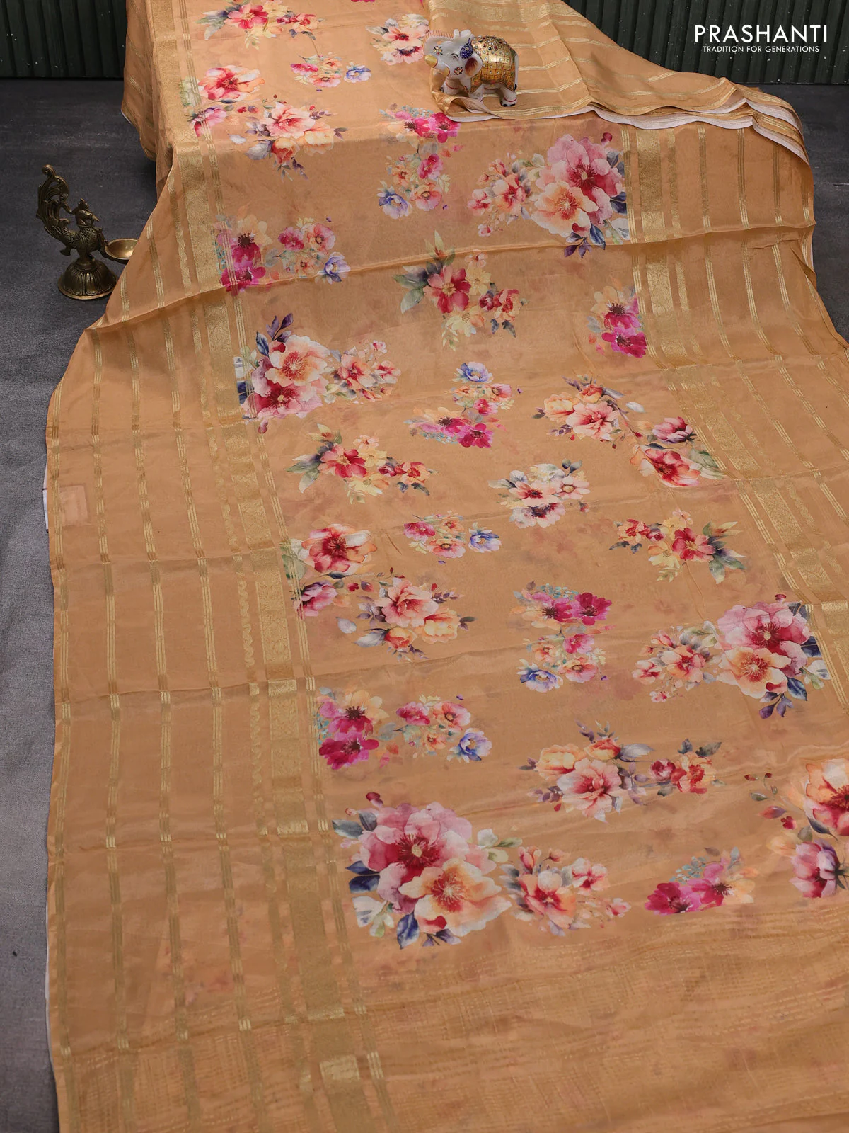 Semi georgette saree pale orange shade with allover floral prints and long zari woven border - Image 2