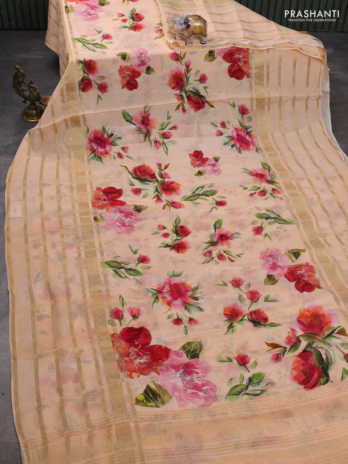 Semi georgette saree pale orange with allover floral prints and long zari woven border - Image 2