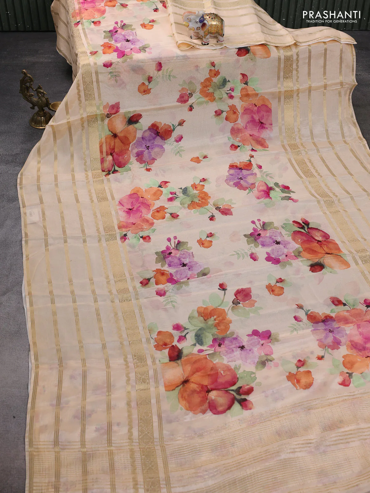 Semi georgette saree pale orange with allover floral prints and long zari woven border - Image 2