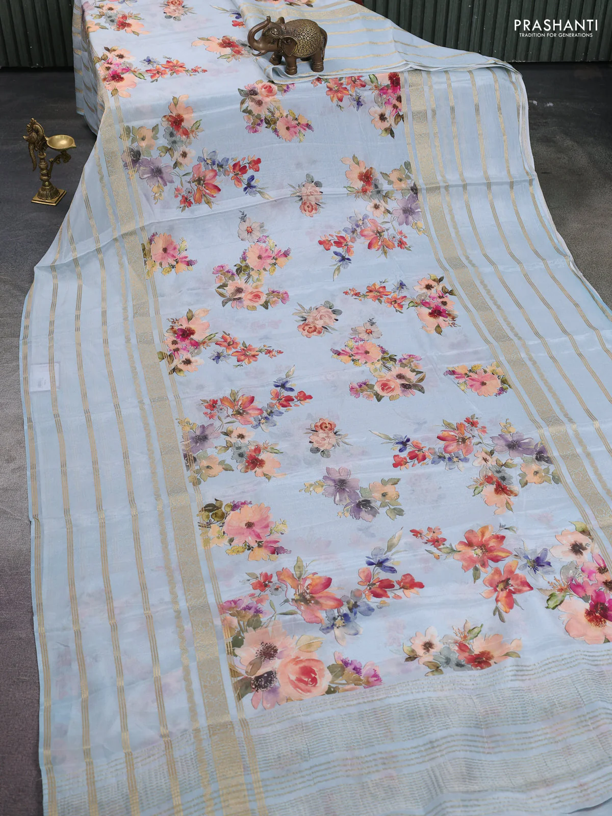 Semi georgette saree pastel blue with allover floral prints and long zari woven border - Image 2