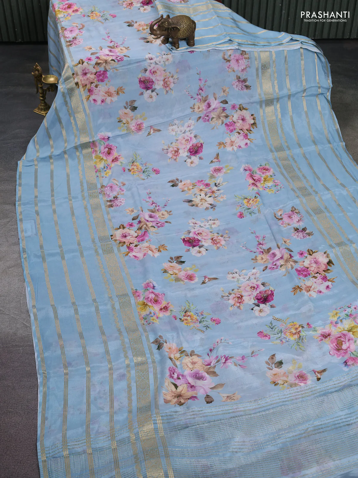 Semi georgette saree pastel blue with allover floral prints and long zari woven border - Image 2