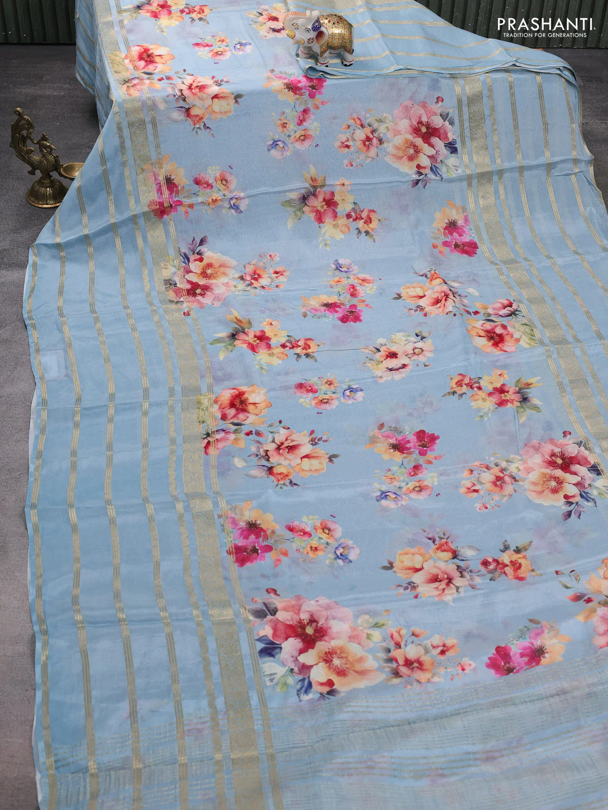 Semi georgette saree pastel blue with allover floral prints and long zari woven border - Image 2