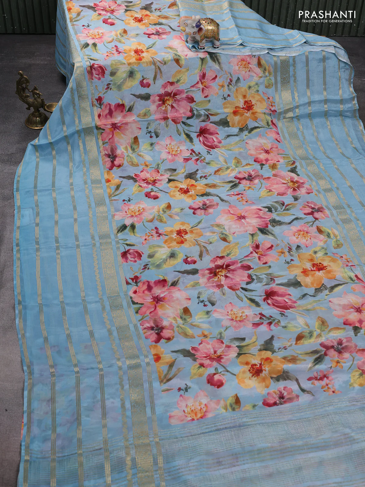 Semi georgette saree pastel blue with allover floral prints and long zari woven border - Image 2