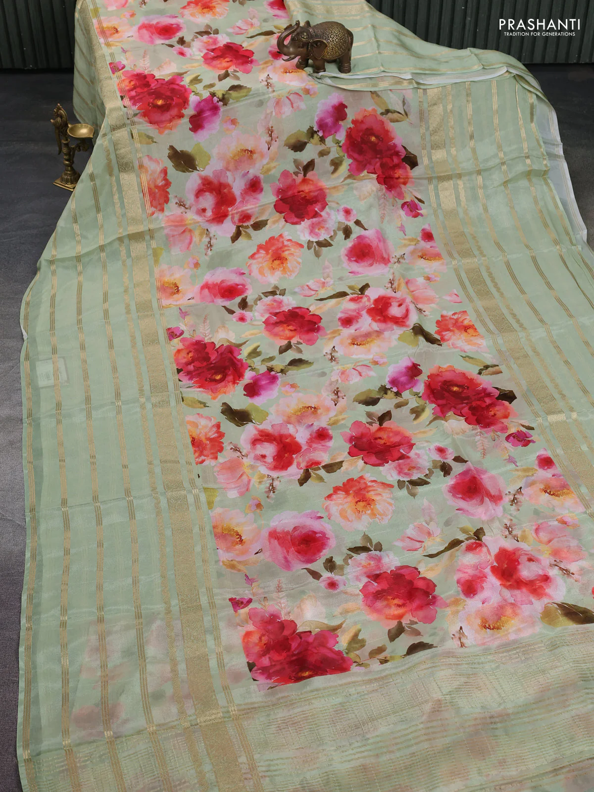 Semi georgette saree pastel green with allover floral prints and long zari woven border - Image 2