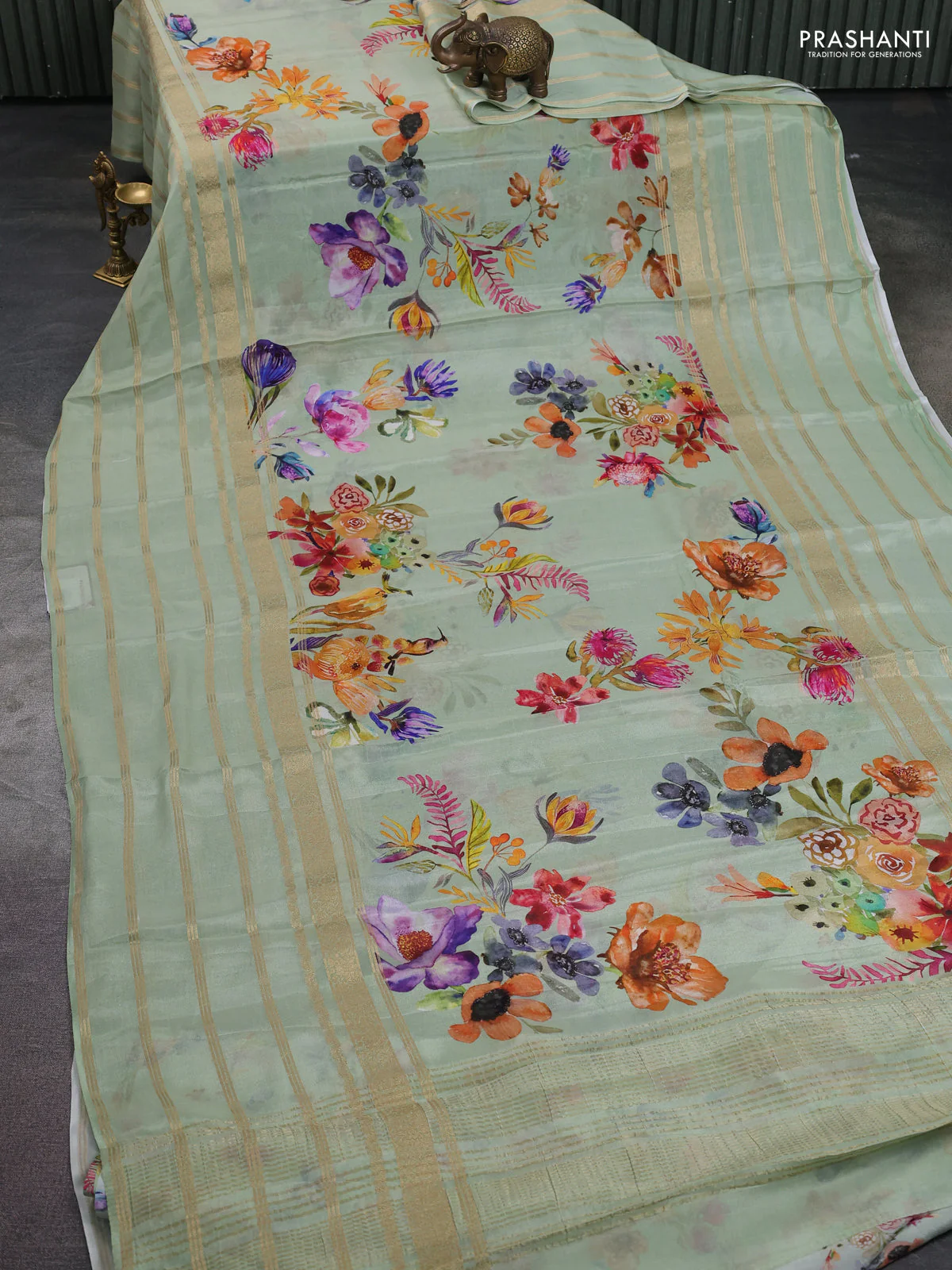 Semi georgette saree pastel green with allover floral prints and long zari woven border - Image 2