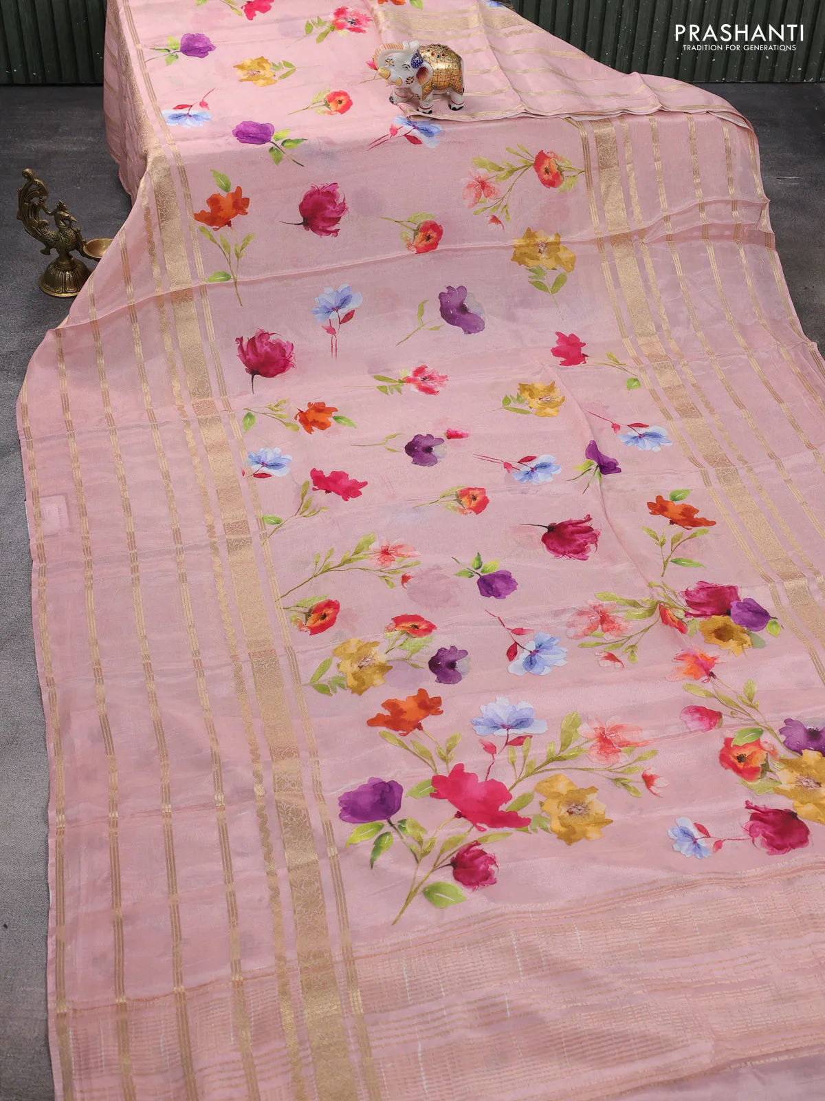 Semi georgette saree peach shade with allover floral prints and long zari woven border - Image 2