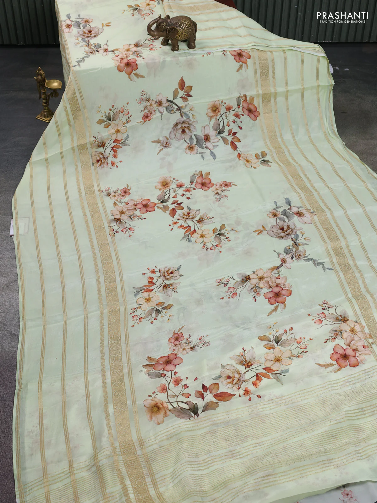 Semi georgette saree pista green with allover floral prints and long zari woven border - Image 2