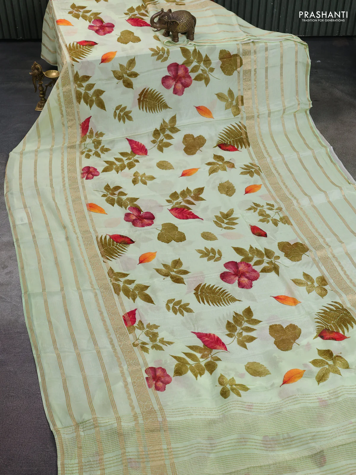 Semi georgette saree pista green with allover floral prints and long zari woven border - Image 2