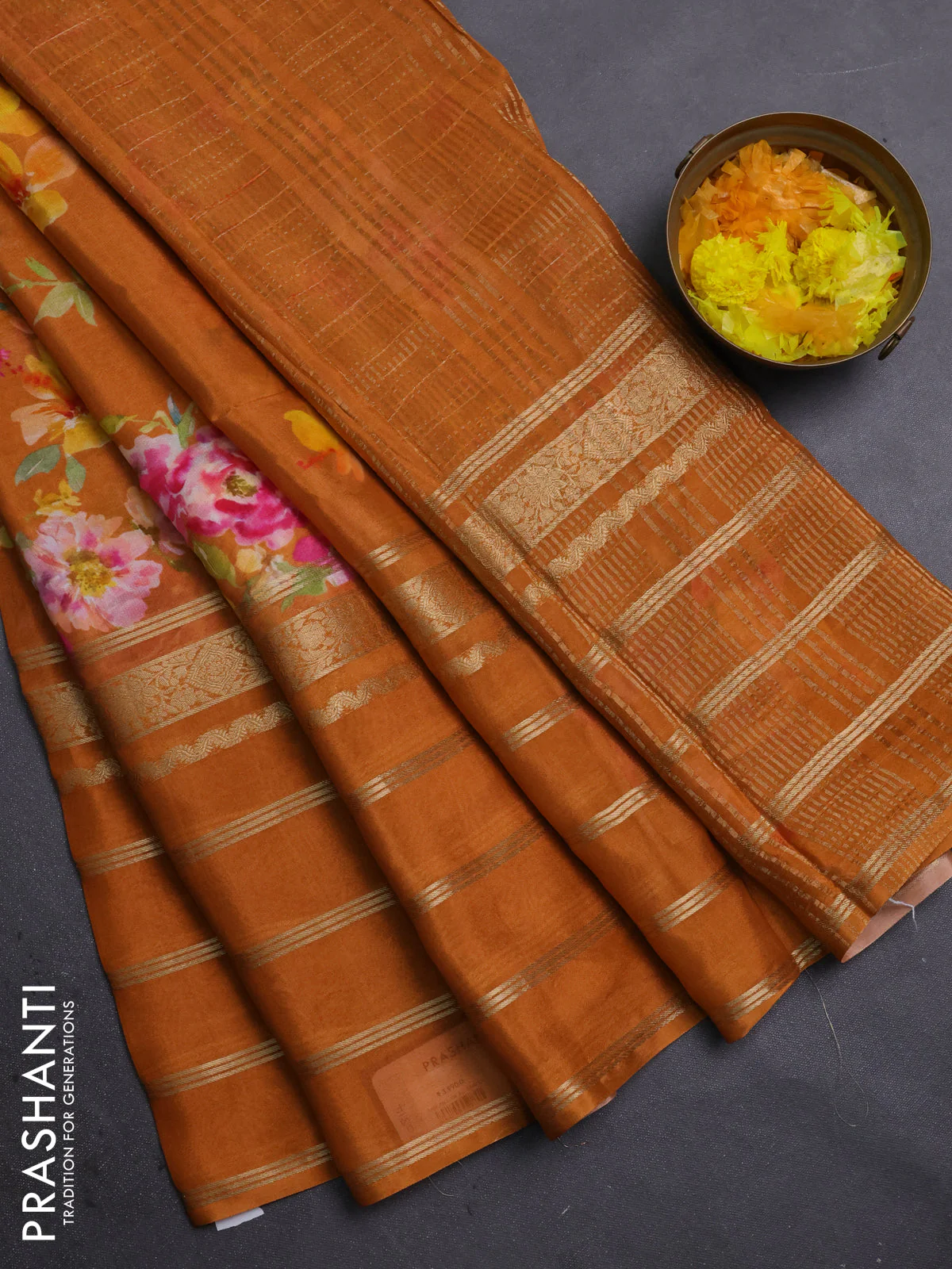 Semi georgette saree rustic orange with allover floral prints and long zari woven border